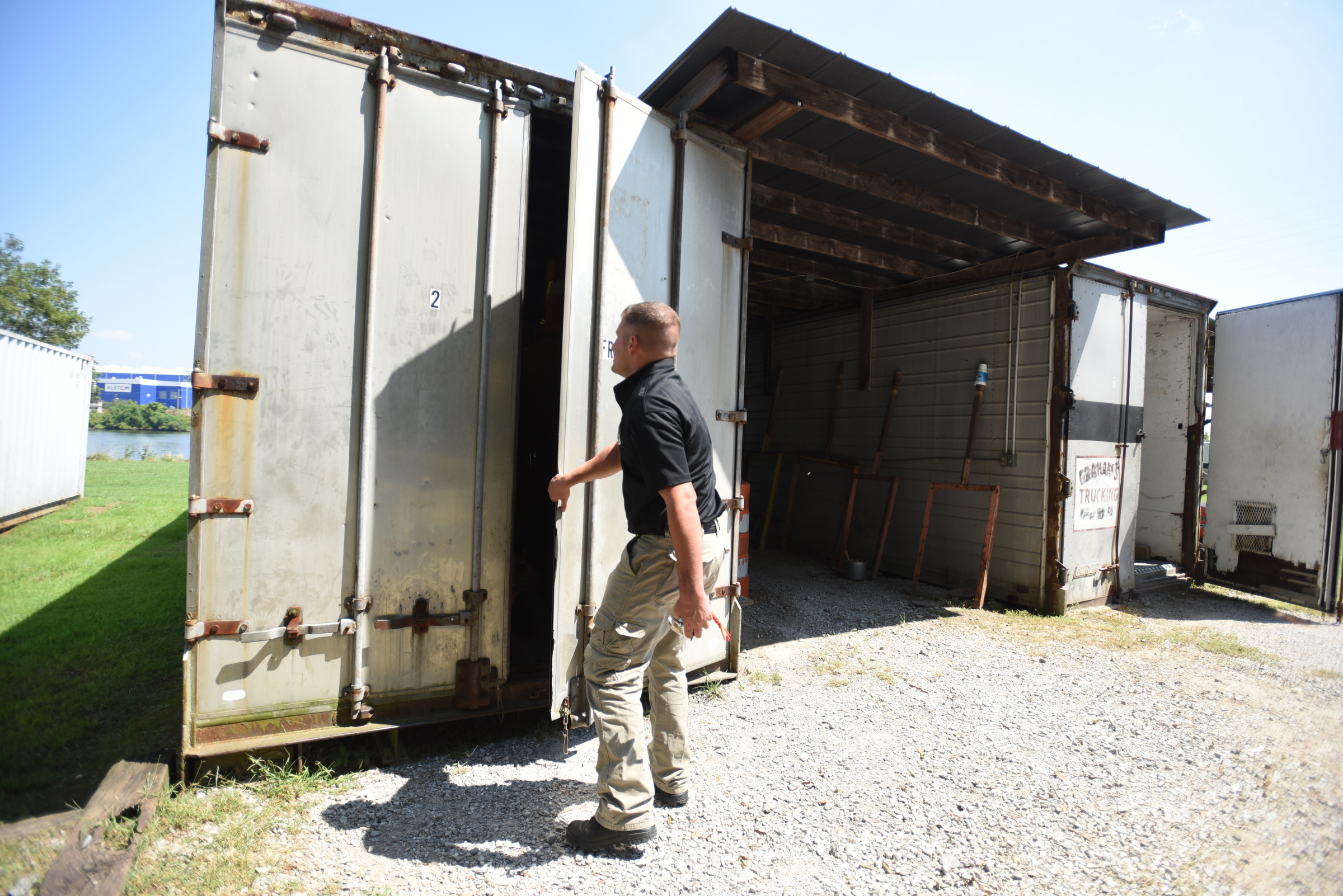 Officer Joe Sabba opens a storage shed Thursday, September 3, 2015 at the police firing range on Moccasin Bend Road.