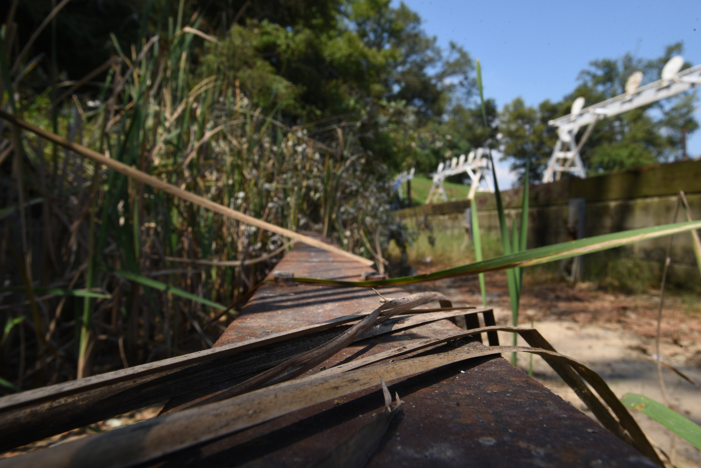 A moving target used to slide up and down the track, now covered with grass Thursday, September 3, 2015 at the police firing range on Moccasin Bend Road.