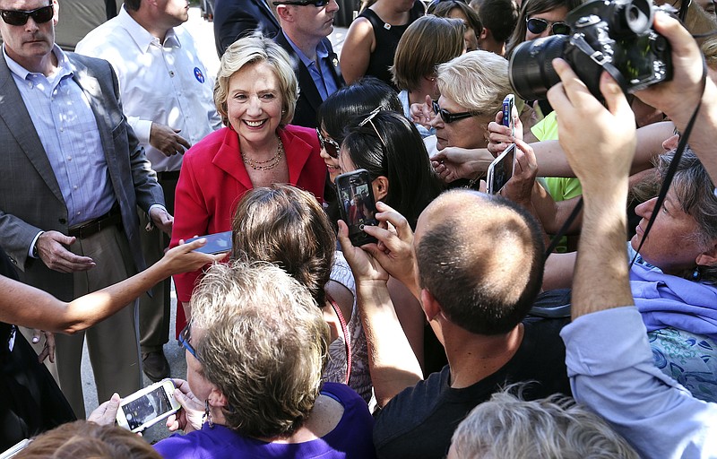 Democratic presidential candidate Hillary Rodham Clinton is surrounded by supporters and members of the press recently in New Hampshire.
