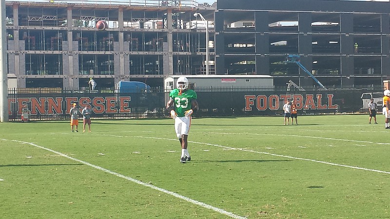 Tennessee safety LaDarrell McNeil plays catch with a teammate during the Vols' practice at Haslam Field on Sept. 8, 2015.