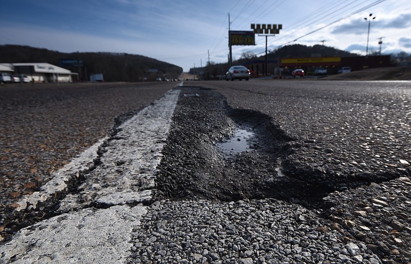 Southbound traffic on Dayton Pike at state Highway 153 must deal with eroding asphalt in the left lane near the U.S. Highway 27 exit, just south of Soddy-Daisy.