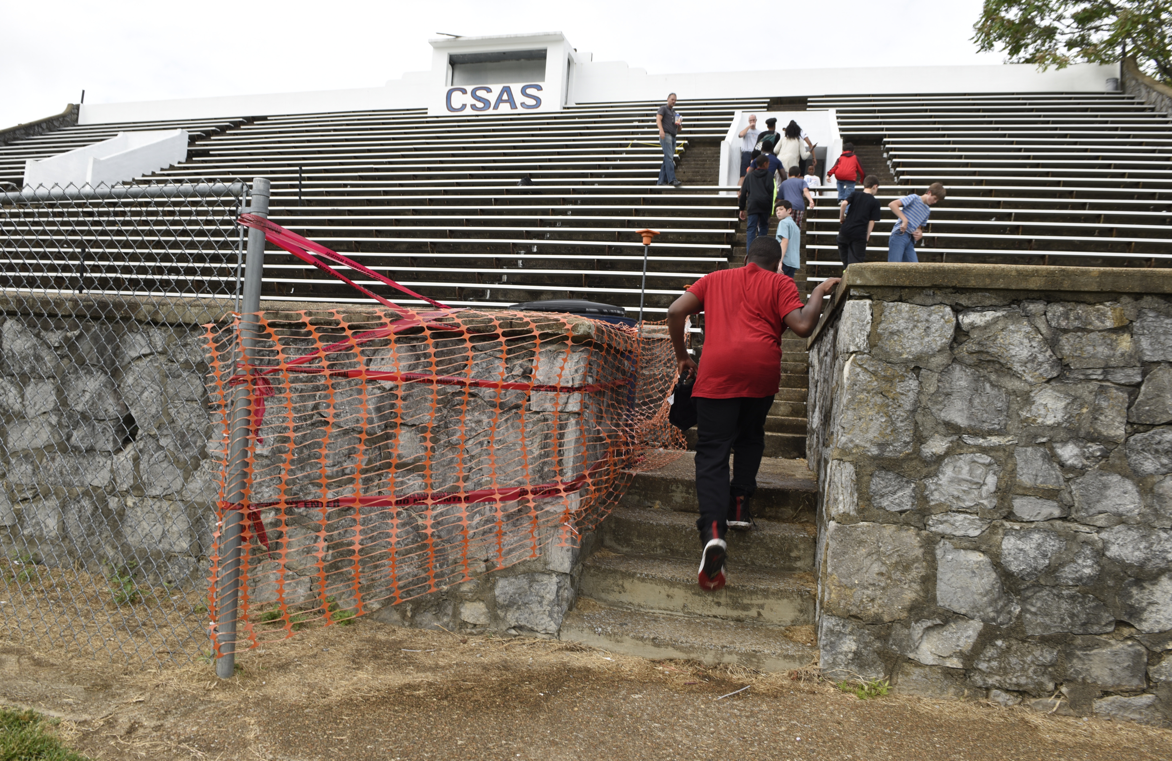 Students walk up the steps at the bleachers at the soccer field for the Chattanooga School for the Arts and Sciences on Wednesday, Sept. 9, 2015, in Chattanooga, Tenn. Hamilton County school officials are going to check concrete bleachers at several area school after the crumbling stadium at East Ridge High School was recently condemned. The bleachers at CSAS were built for the football field at the old City High School, and are the oldest in Hamilton County.