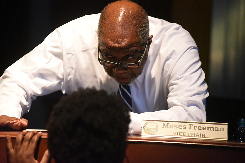 Chattanooga Councilman Moses Freeman, chatting before a City Council meeting earlier this year, would like to see the city mandate a minimum-wage hike for all employees in the city.