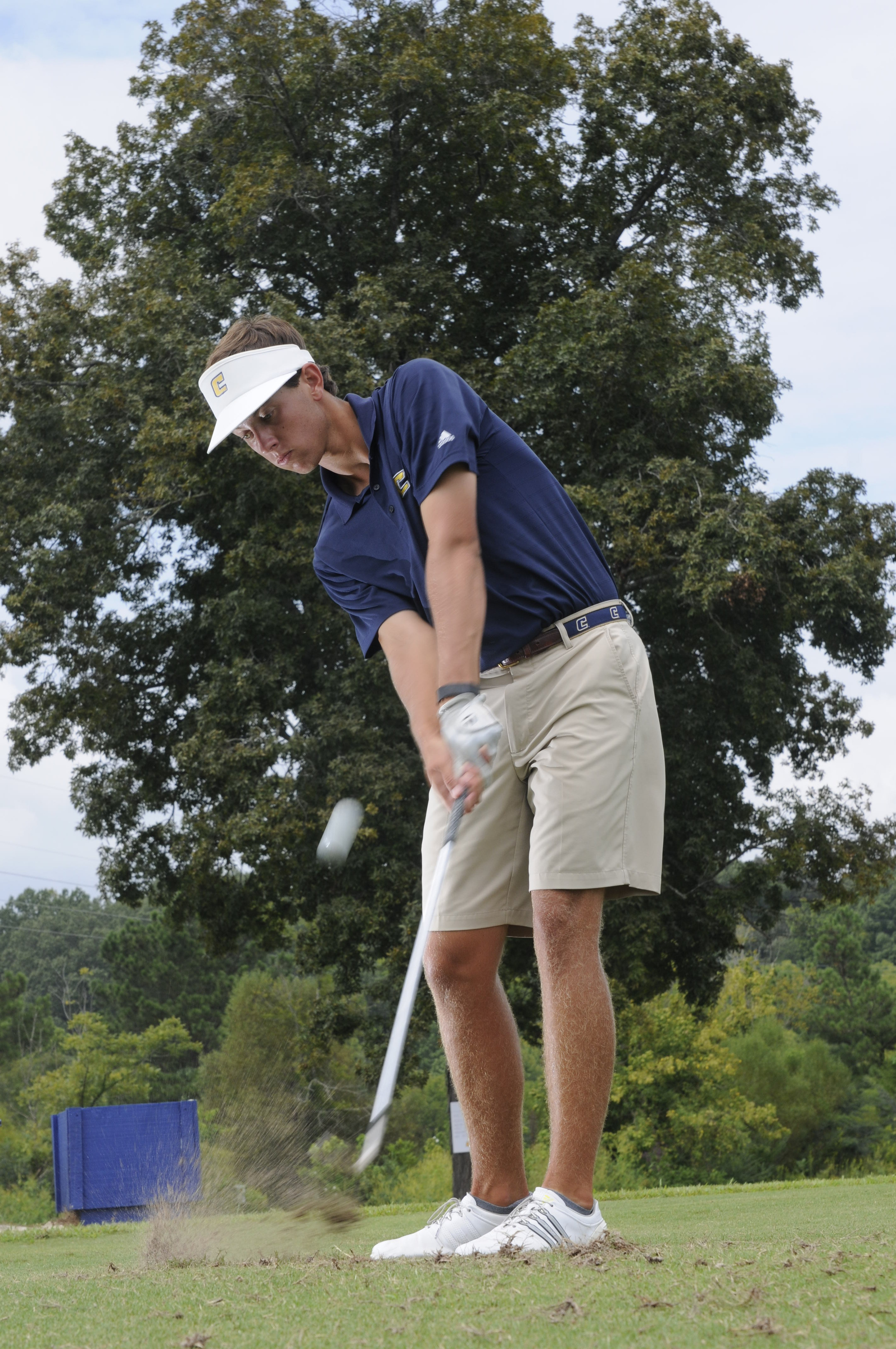Lake Johnson hits short iron shots Wednesday during practice at the UTC Golf center on Hickory Valley Road.