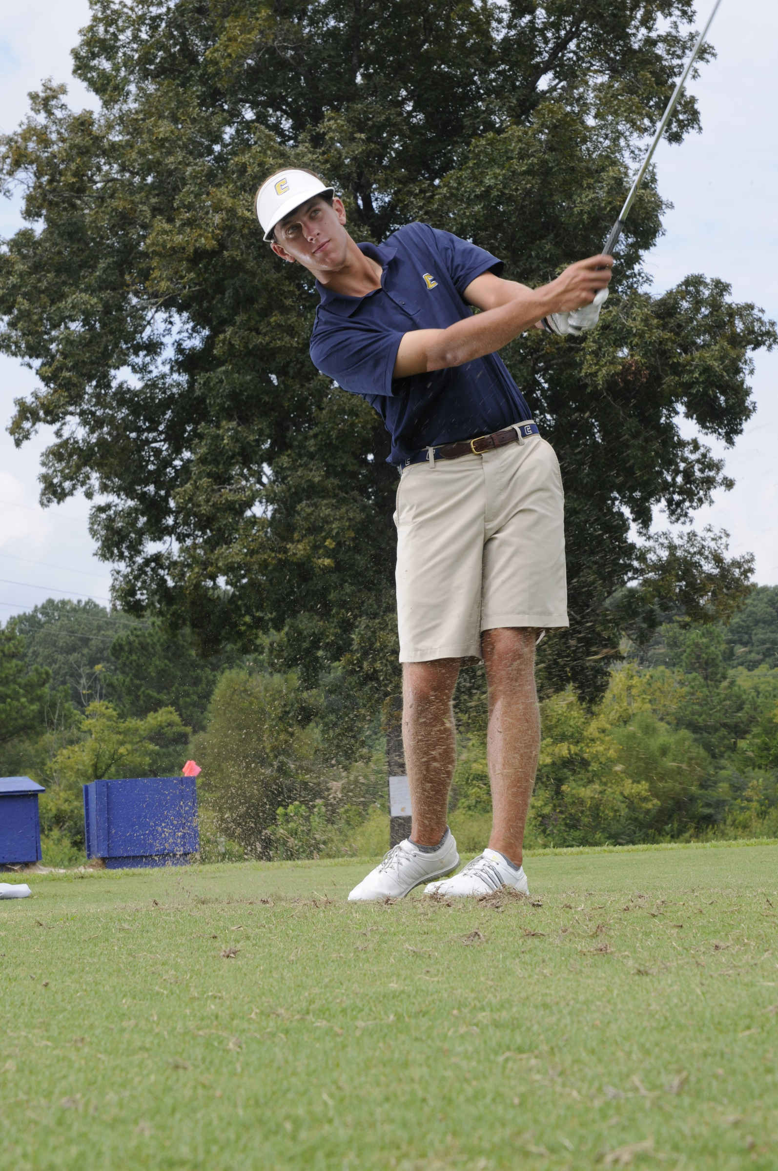 Lake Johnson hits short iron shots Wednesday during practice at the UTC Golf center on Hickory Valley Road.