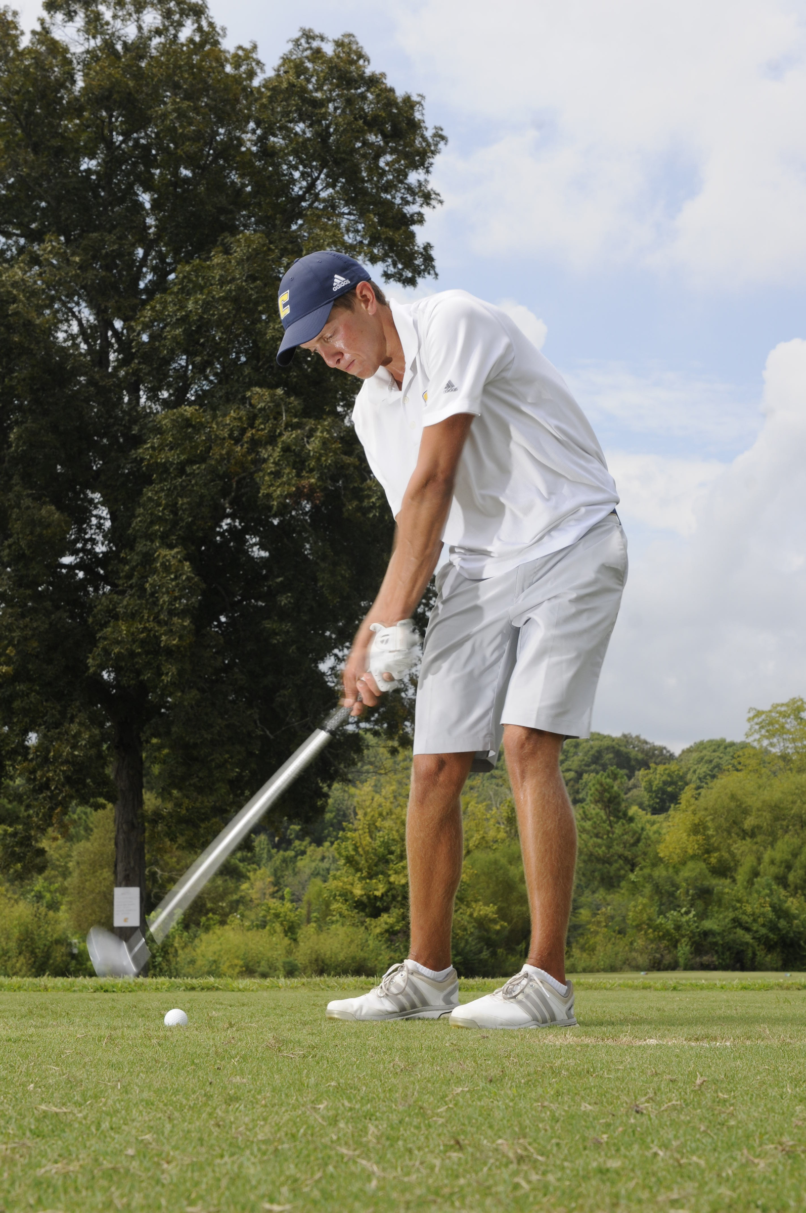 Wes Gosselin hits short iron shots Wednesday during practice at the UTC Golf center on Hickory Valley Road.