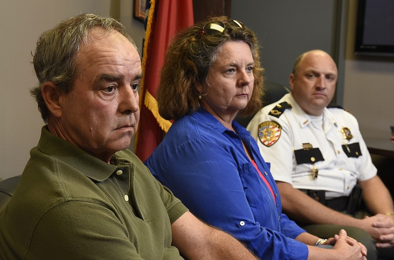Neal Keller, left, and Zoe Keller meet with reporters in the office of Bradley County Sheriff Eric Watson, right, on Thursday, Sept. 10, 2015, in Cleveland, Tenn. The Keller's son, Joe Keller, is missing in Colorado. 