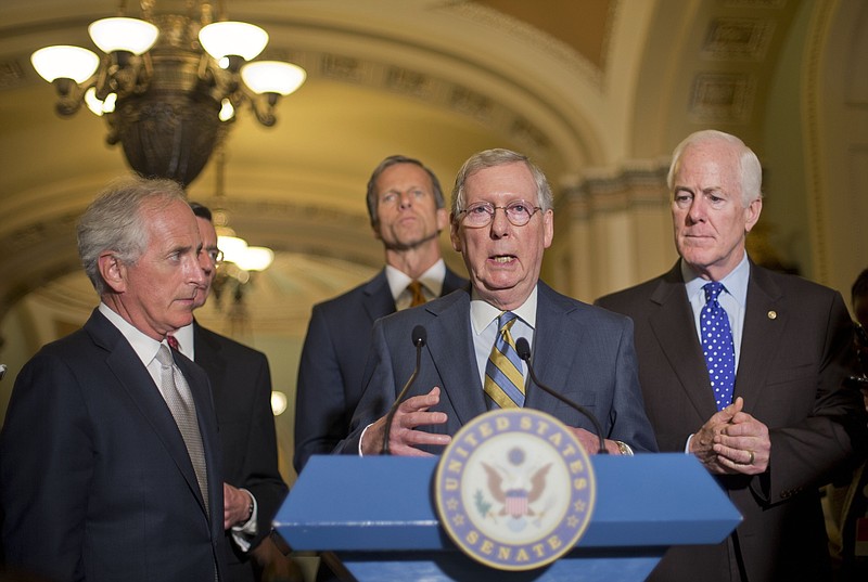 Senate Majority Leader Mitch McConnell, center, with from left, Sen. Bob Corker, R-TN., Sen. John Barrasso, R-Wyo., Sen. John Thune, R-S.D., and Senate Majority Whip John Cornyn of Texas, speak to reporters on Capitol Hill after the Iran deal vote.