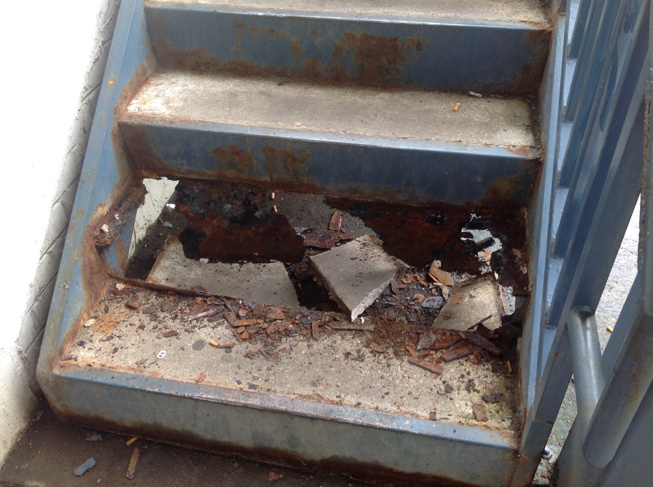 A staircase crumbles at Superior Creek Lodge.