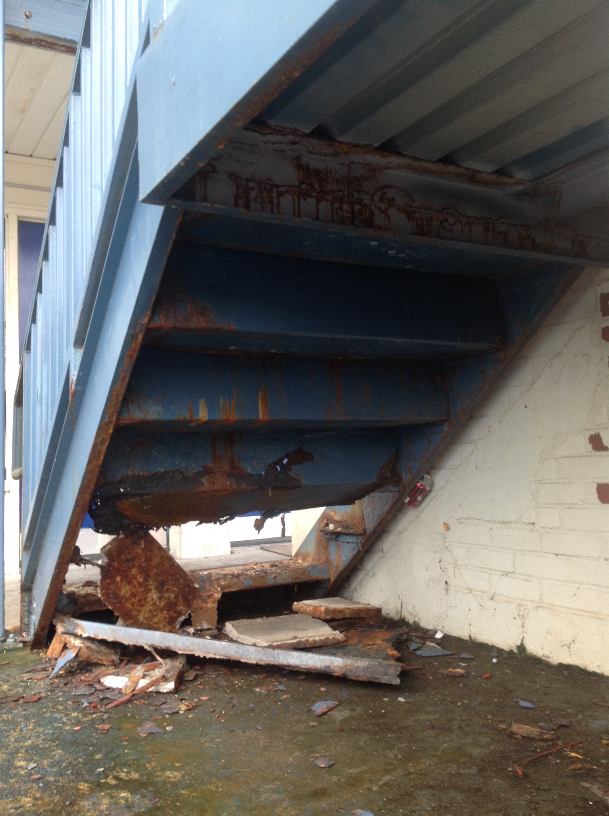 A staircase crumbles at Superior Creek Lodge.