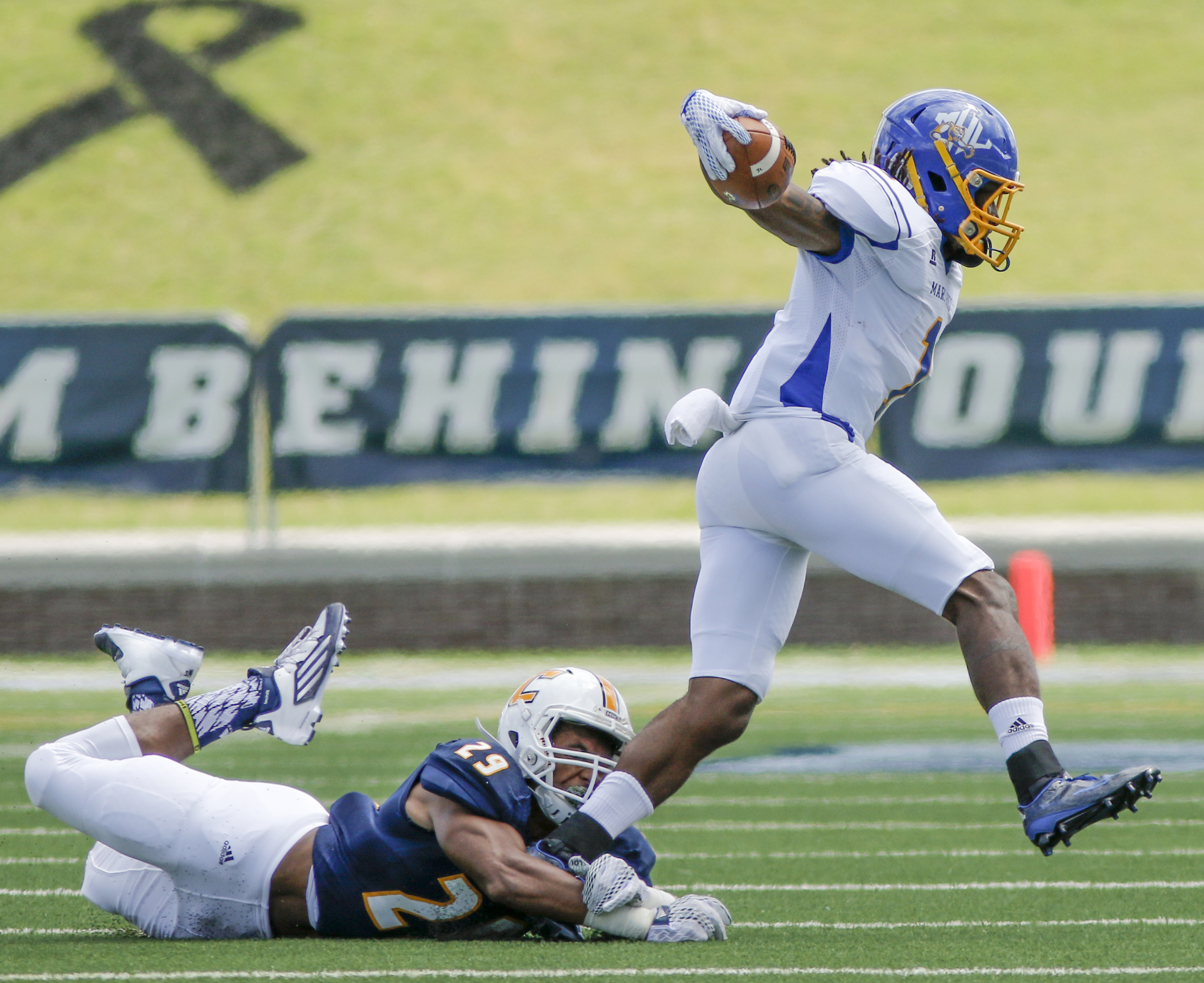 UTC defensive back Lucas Webb tackles Mars Hill running back Shaikel Davis during the Mocs' football game against the Lions at Finley Stadium on Saturday, Sept. 12, 2015, in Chattanooga, Tenn. UTC won 44-34.