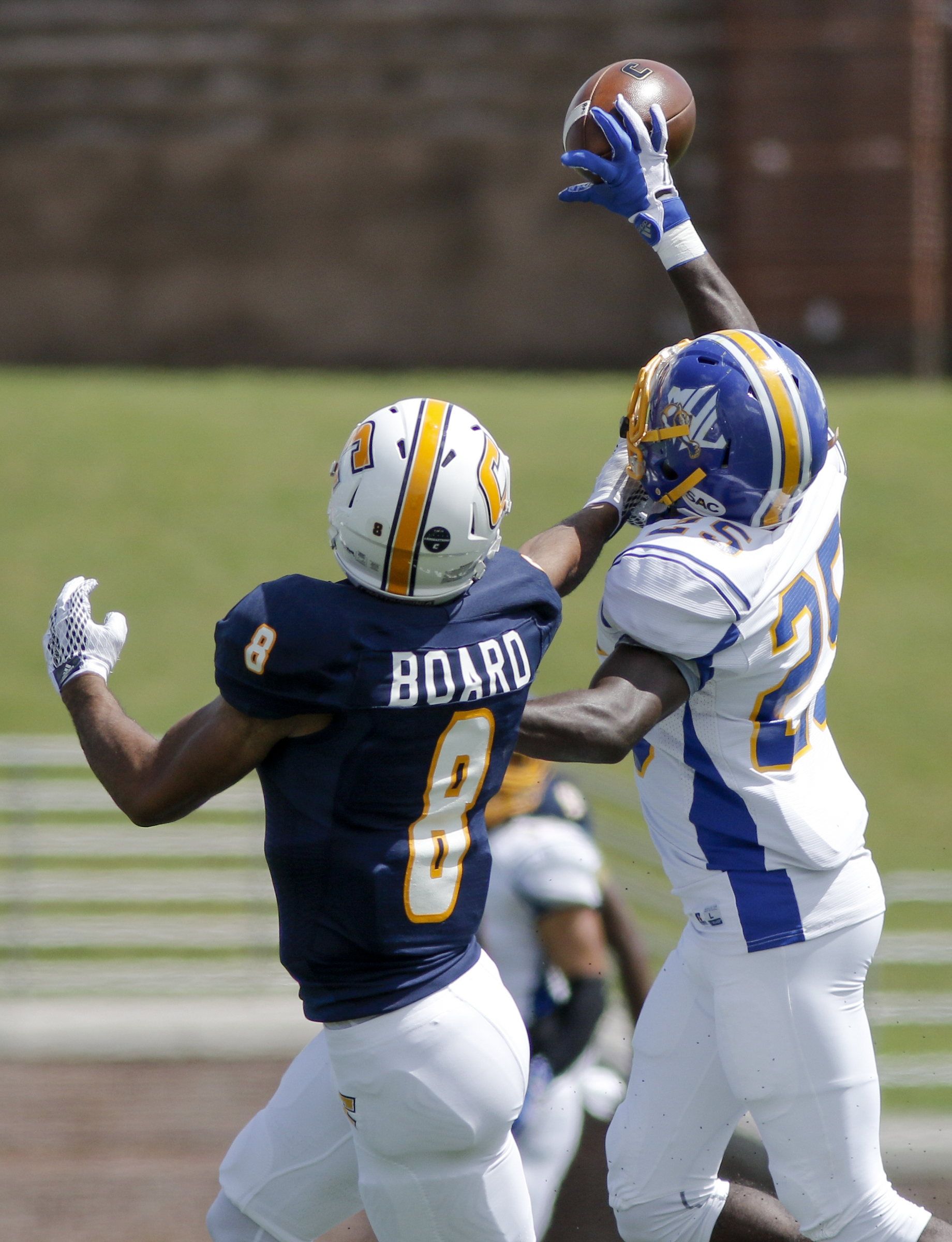 Mars Hill defensive back Robert Morgan, Jr., right, blocks a pass intended for UTC wide receiver C.J. Board during the Mocs' football game against the Lions at Finley Stadium on Saturday, Sept. 12, 2015, in Chattanooga, Tenn. UTC won 44-34.