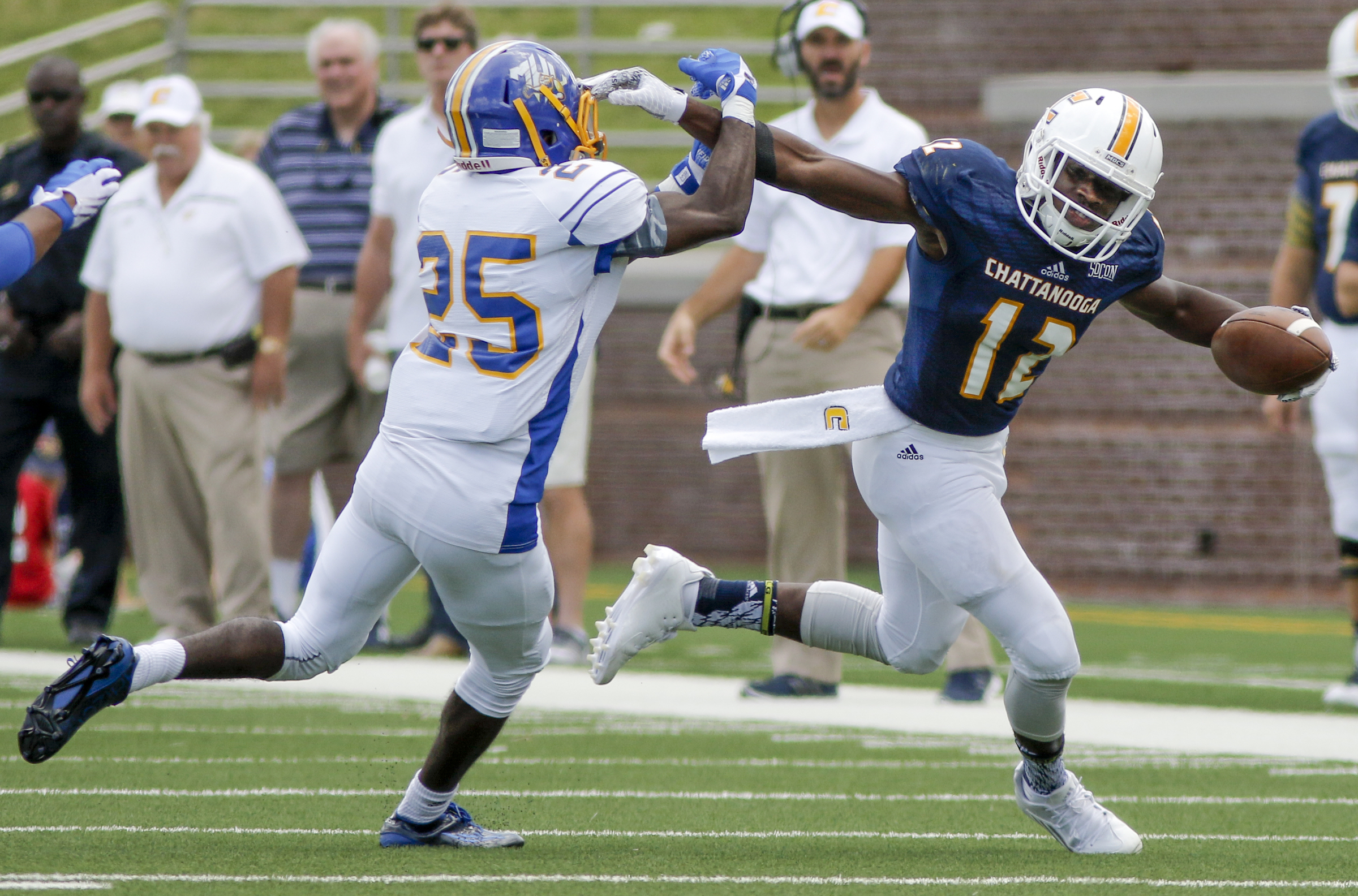 UTC wide receiver Xavier Borishade stiff-arms Mars Hill linebacker Malik Sims during the Mocs' football game against the Lions at Finley Stadium on Saturday, Sept. 12, 2015, in Chattanooga, Tenn. UTC won 44-34.