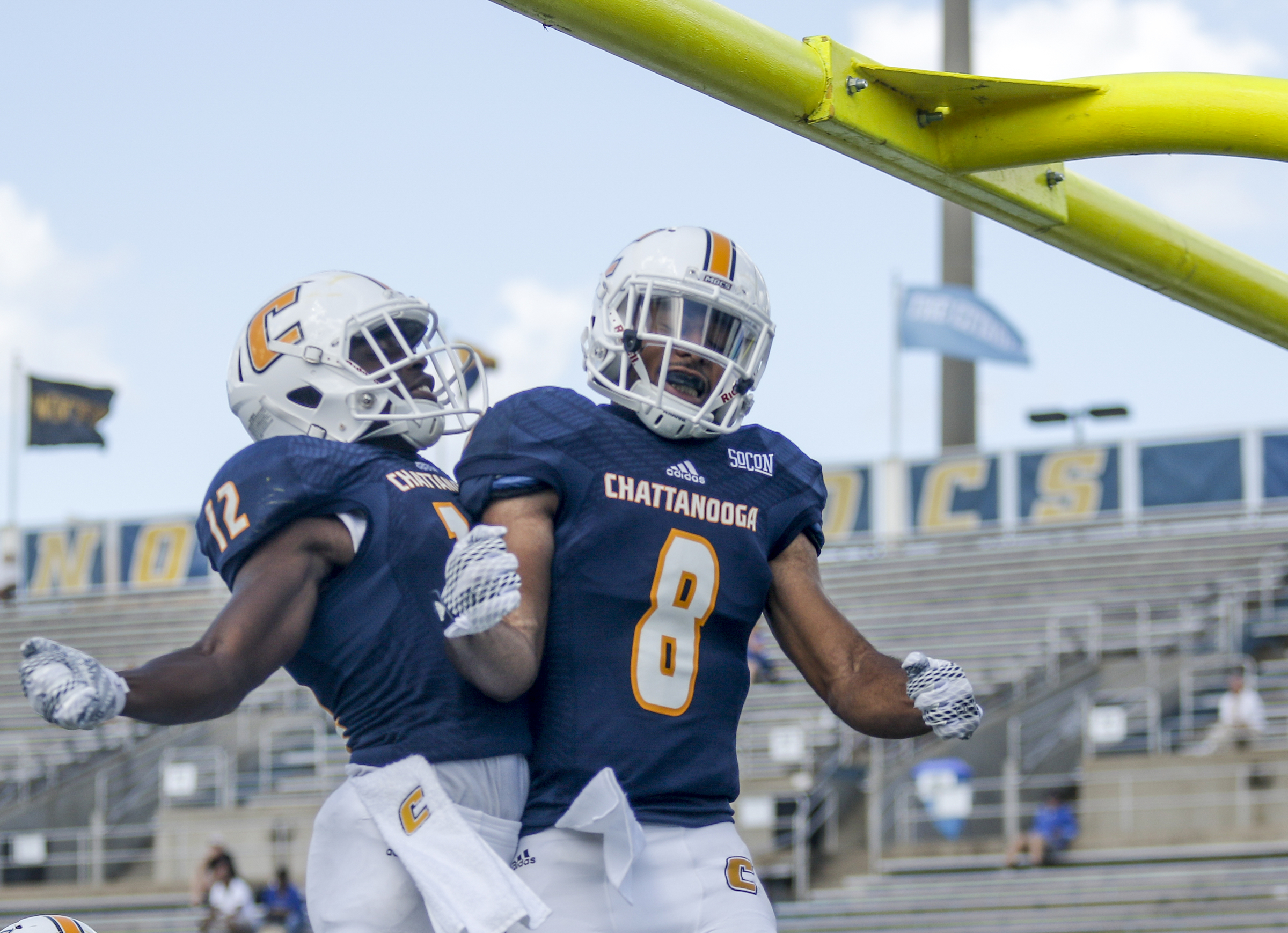 UTC players C.J. Board, right, and Xavier Borishade celebrate a touchdown during the Mocs' football game against the Lions at Finley Stadium on Saturday, Sept. 12, 2015, in Chattanooga, Tenn. UTC won 44-34.