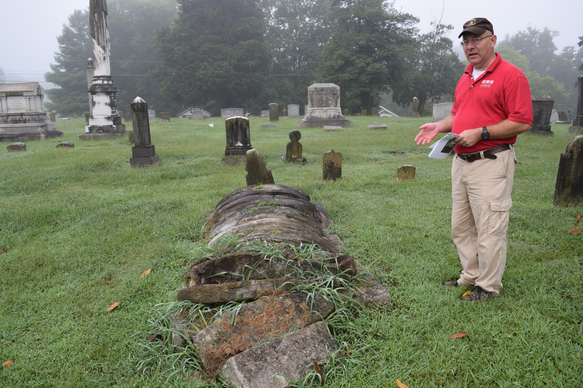 Tennessee Overhill Heritage Association executive director Gerald Hodge talks about a project to document the oddest and most unusual graves and markers in McMinn, Monroe and Polk counties. Here, Hodge talks about the looted grave of what was could be a Cherokee or Creek chief who was buried at Cedar Grove Cemetery in Athens, Tenn., around 1840.