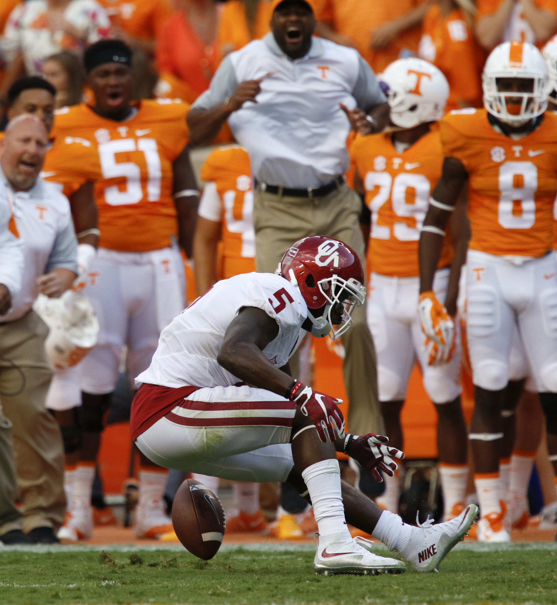 UT's sideline gets excited as Oklahoma's Durron Neal (5) drops fails to complete a pass during the first half of play Saturday. The Volunteers played the Sooner's at home on September 12, 2015 at Neyland Stadium in Knoxville, Tennessee.