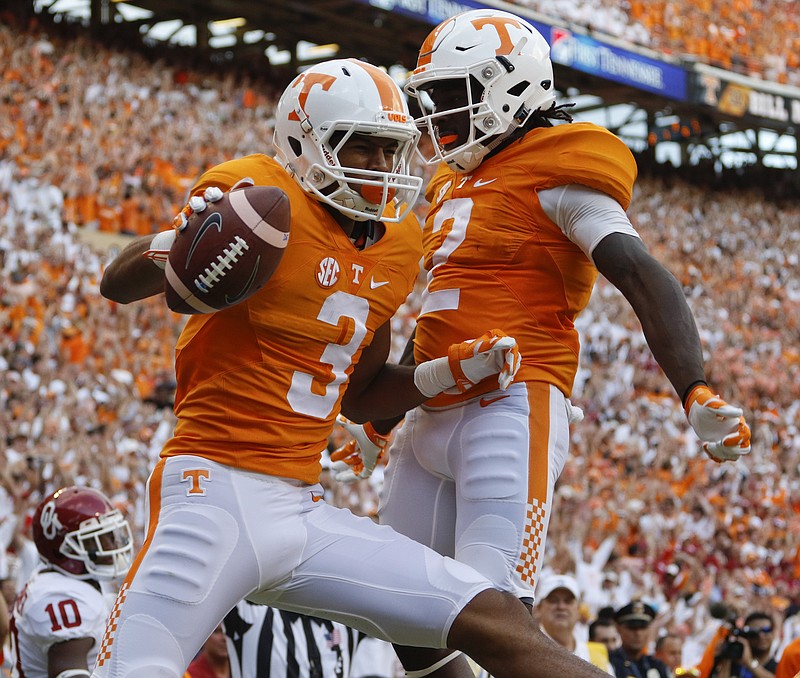 
UT's Josh Malone (3) celebrates his touchdown with teammate Pig Howard (2) while playing against Oklahoma during the first half of play Saturday. The Volunteers played the Sooner's at home on September 12, 2015 at Neyland Stadium in Knoxville, Tennessee. 