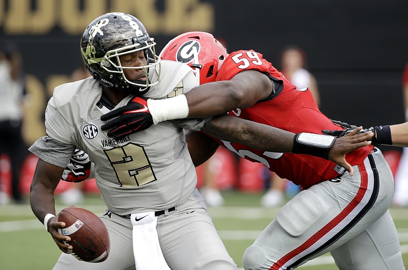Vanderbilt quarterback Johnny McCrary (2) is sacked by Georgia linebacker Jordan Jenkins (59) for a 7-yard loss in the first half of an NCAA college football game Saturday, Sept. 12, 2015, in Nashville.