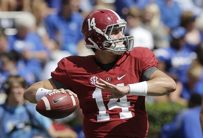 Alabama quarterback Jake Coker (14) sets back to throw the ball during an NCAA college football game against Middle Tennessee, Saturday, Sept. 12, 2015, in Tuscaloosa, Ala. 