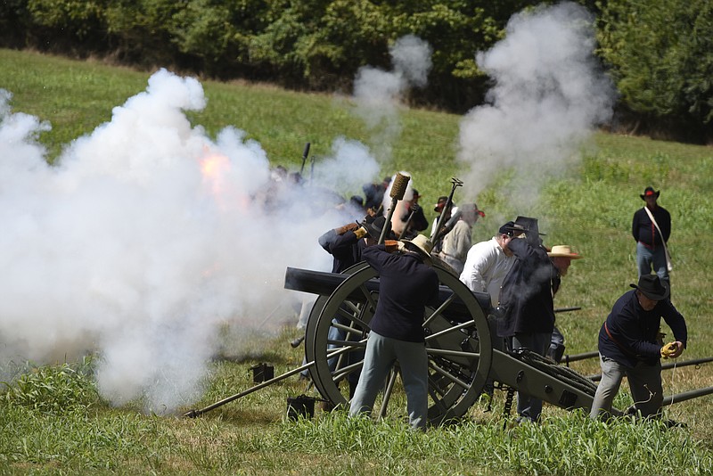 Union cannons roar as they fire imaginary shells at Confederates during the annual Civil War reenactment at the Western and Atlantic Railroad Tunnel Heritage Center Museum on Sunday, Sept. 13, 2015, in Tunnel Hill, Ga.