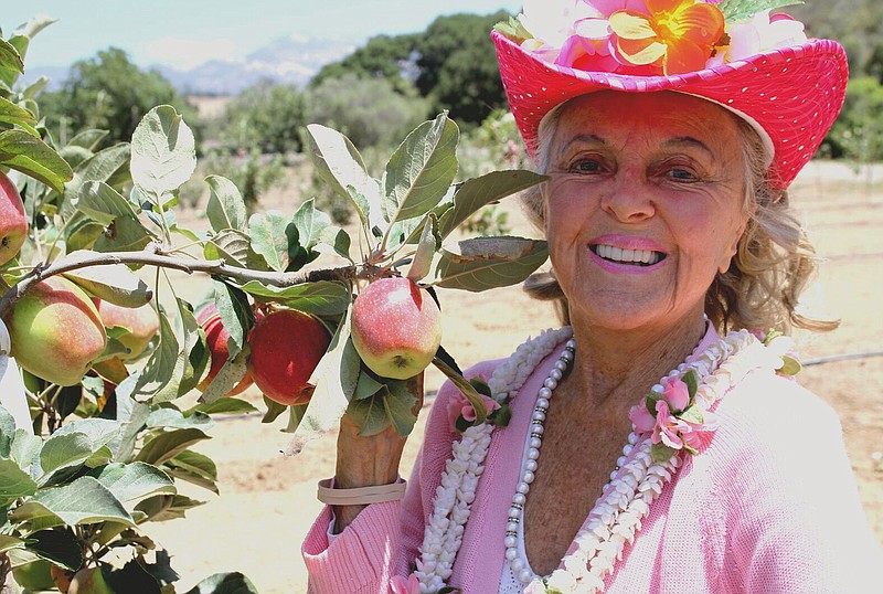 Patricia Bragg's father, Paul, began selling organic, raw apple cider vinegar at his Los Angeles health food store in 1912, growing his own apples and putting out a book, "Apple Cider Vinegar — Miracle Health System," which has sold more than 9 million copies around the world. (Courtesy of Bragg Live Food Products via AP)