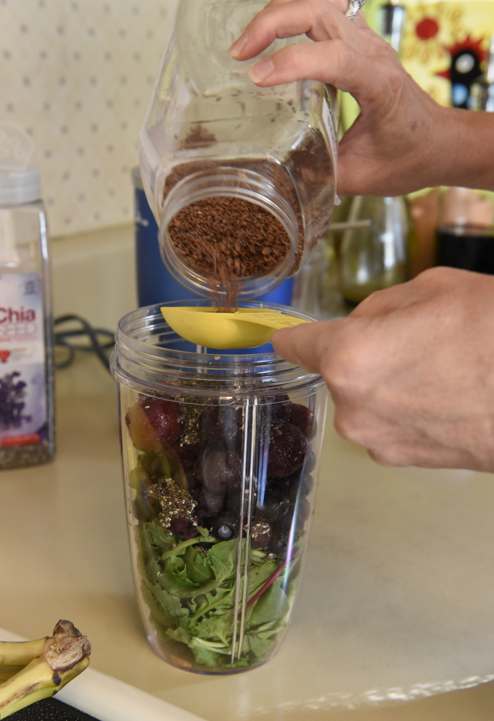 Sharon Thomas adds flax seed as she assembles ingredients to make a smoothie in her home in the East Brainerd community on Sunday, Sept. 13, 2015, in Chattanooga, Tenn. Other ingredients include a kale medley, chia seed, green tea, yogurt, blueberries and dark sweet cherries.