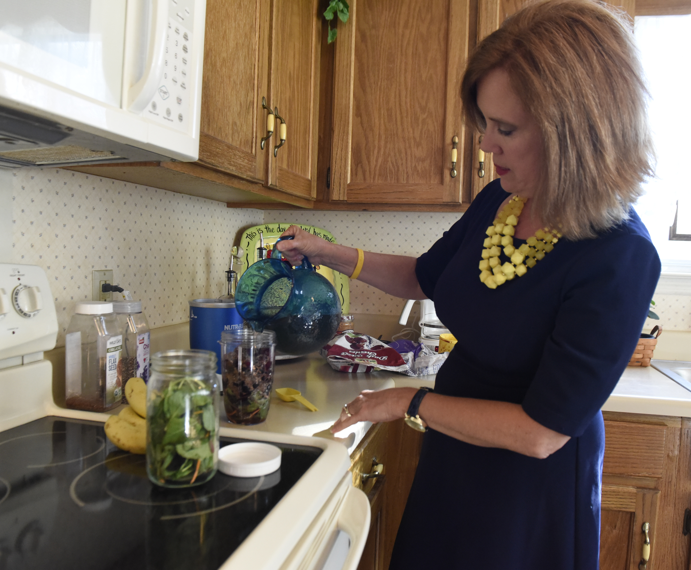 Sharon Thomas pours in green tea as she makes a smoothie in her home in the East Brainerd community on Sunday, Sept. 13, 2015, in Chattanooga, Tenn.