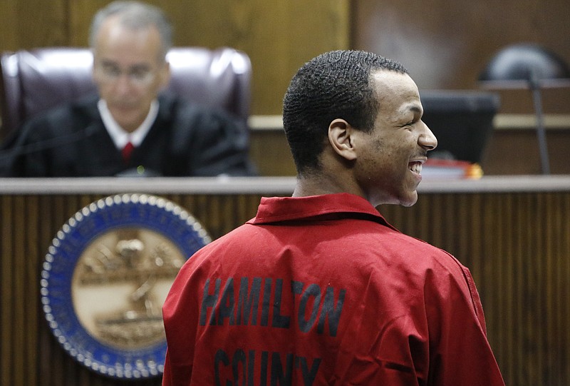 DeAngelo Demarcus Dews smiles into the crowd after having four of his five charges dropped before being sentenced to serve six years by Judge Curtis Smith for aggravated assault after firing his weapon and wounding a man at a Chattanooga, Tenn., Bi-Lo earlier this month. 