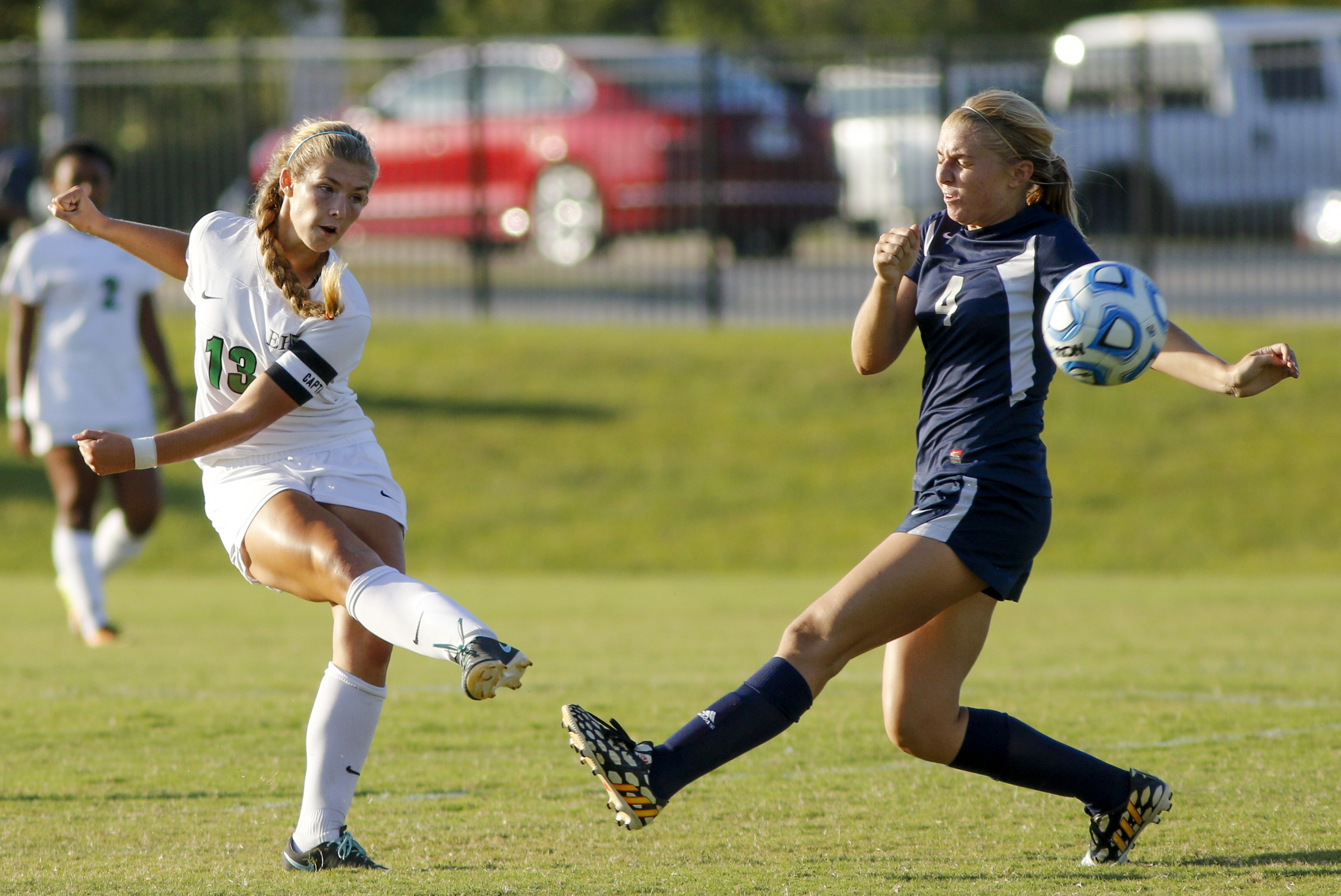East Hamilton's Camryn Harris, left, takes a shot on the goal that flies past Soddy-Daisy's Alyssa Scarpelli during their prep soccer match Tuesday, Sept. 15, 2015, at East Hamilton High School in Chattanooga, Tenn.