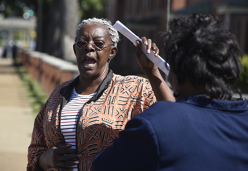 Ruthie Wright speaks to Chattanooga Hamilton County NAACP president Dr. Elenora Woods, right, after the Chattanooga Hamilton County NCAAP held a news conference on the sidewalk in front of the East Lake Courts on Tuesday, Sept. 15, 2015, in Chattanooga, Tenn. Wright is a long-time resident of the community near the East Lake Courts. 