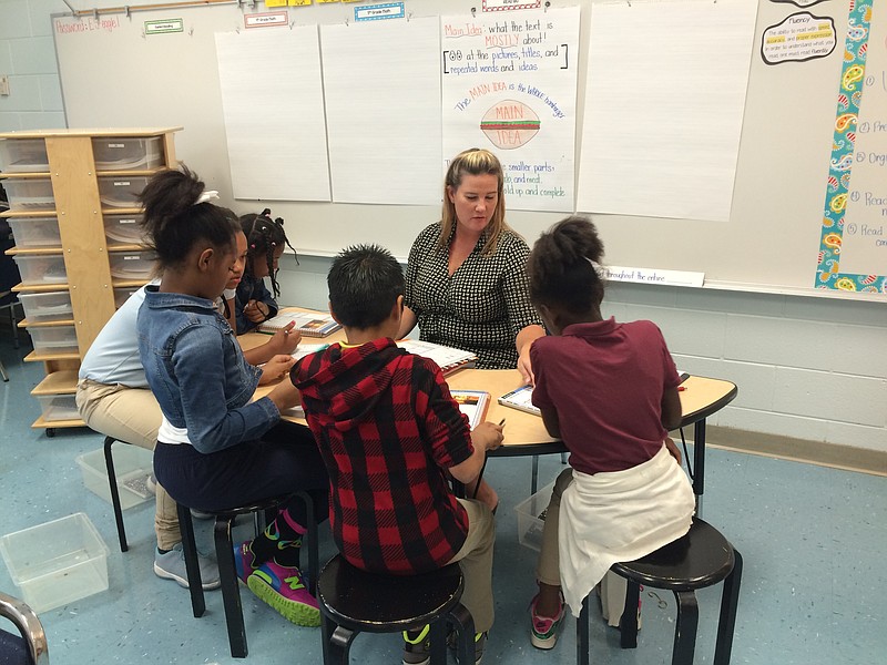 Stacy Hooper works with students in East Side Elementary's Read 180 Lab.  Students visit the lab daily to work on reading, writing, spelling and vocabulary with Hooper. The lab received a $25,000 grant from the Leonore Annenberg School Fund for the Children this year. 