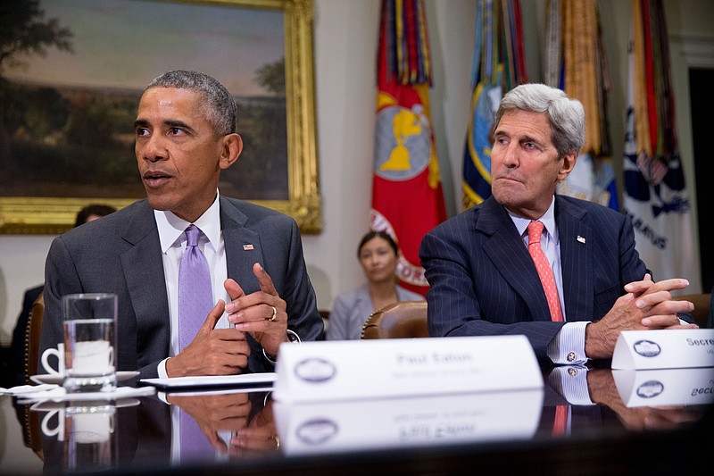 President Barack Obama, accompanied by Secretary of State John Kerry, meets with veterans and Gold Star Mothers to discuss the Iran Nuclear deal on Sept. 10 in the Roosevelt Room at the White House in Washington.