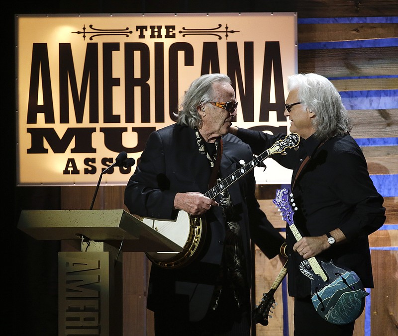 
              Ry Cooder, left, presents the Lifetime Achievement Award for Instrumentalist to Ricky Skaggs at the Americana Music Honors and Awards show Wednesday, Sept. 16, 2015, in Nashville, Tenn. (AP Photo/Mark Zaleski)
            