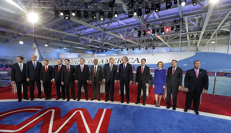 Republican presidential candidates, from left, former Pennsylvania Sen. Rick Santorum, former New York Gov. George Pataki, Sen. Rand Paul, R-Ky., former Arkansas Gov. Mike Huckabee, Sen. Marco Rubio, R-Fla., Sen. Ted Cruz, R-Texas, retired neurosurgeon Ben Carson, businessman Donald Trump, former Florida Gov. Jeb Bush, Wisconsin Gov. Scott Walker, businesswoman Carly Fiorina, Ohio Gov. John Kasich, and New Jersey Gov. Chris Christie take the stage during the CNN Republican presidential debate at the Ronald Reagan Presidential Library and Museum on Wednesday, Sept. 16, 2015, in Simi Valley, Calif. 