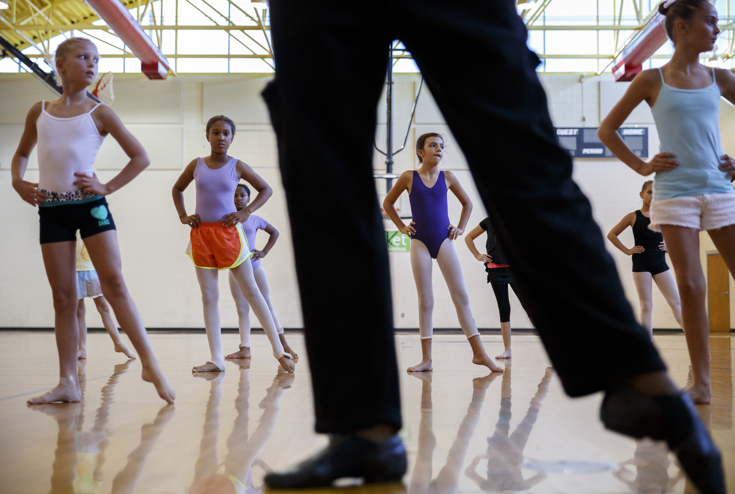 Students are led in warmups by dancer Fred Davis during a master class in dance at the Brainerd Recreation Center on Tuesday, Sept. 15, 2015, in Chattanooga, Tenn. Davis, a Chattanooga native and Center for Creative Arts graduate, is now a professional dancer working in New York City.