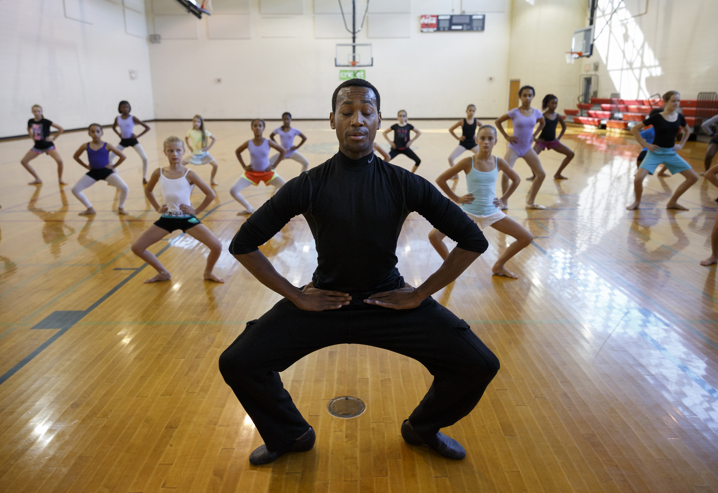 Dancer Fred Davis leads students in warmups during a master class in dance at the Brainerd Recreation Center on Tuesday, Sept. 15, 2015, in Chattanooga, Tenn. Davis, a Chattanooga native and Center for Creative Arts graduate, is now a professional dancer working in New York City.