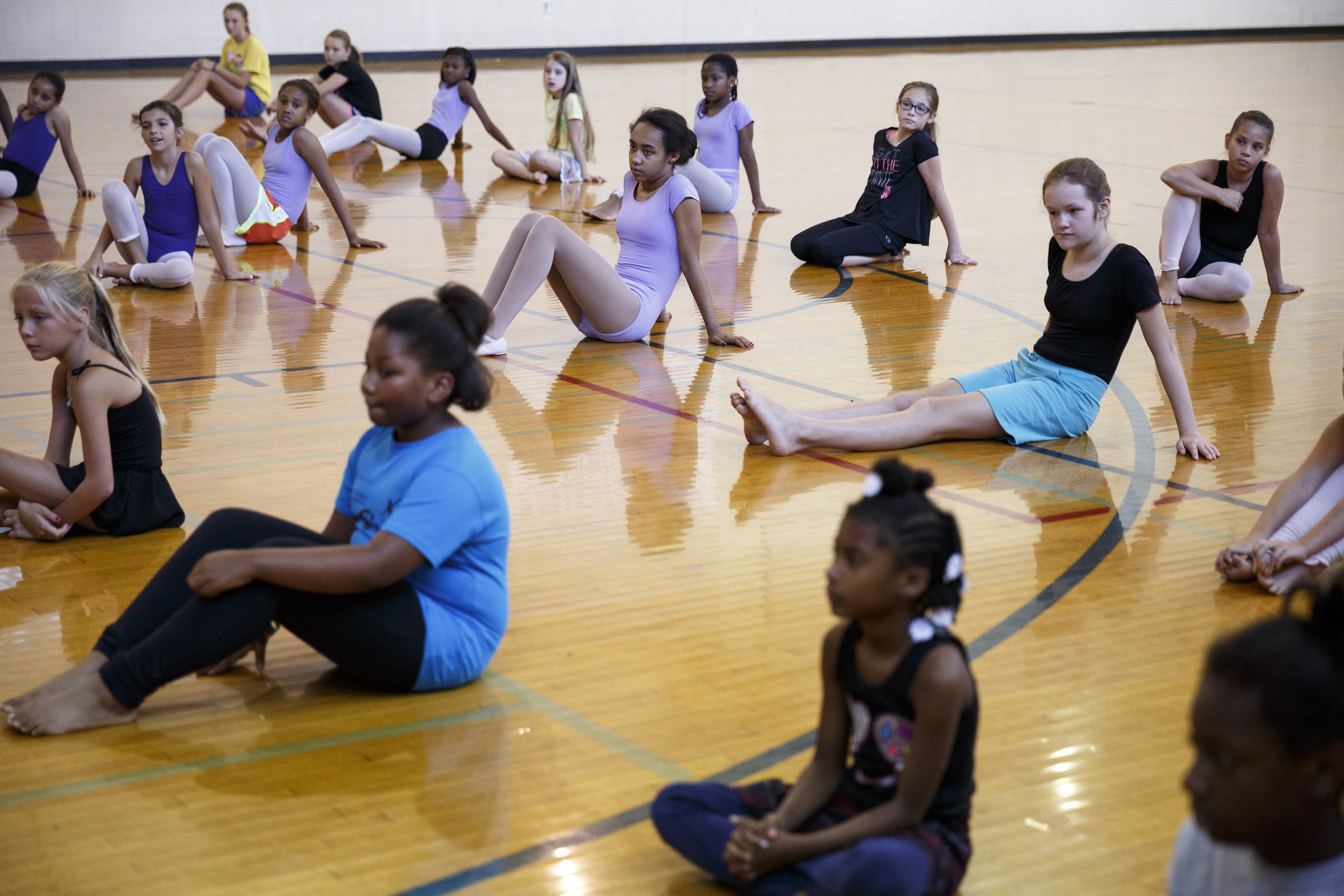 Students listen to dancer Fred Davis explain a warmup during a master class in dance at the Brainerd Recreation Center on Tuesday, Sept. 15, 2015, in Chattanooga, Tenn. Davis, a Chattanooga native and Center for Creative Arts graduate, is now a professional dancer working in New York City.