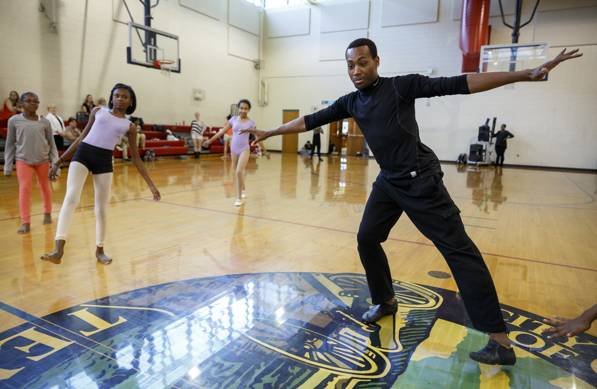 Dancer Fred Davis leads students in a free-movement exercise during a master class in dance at the Brainerd Recreation Center on Tuesday, Sept. 15, 2015, in Chattanooga, Tenn. Davis, a Chattanooga native and Center for Creative Arts graduate, is now a professional dancer working in New York City.