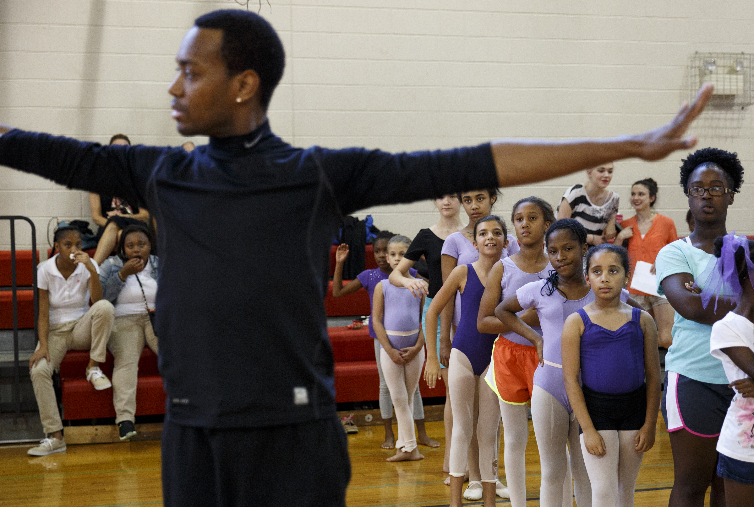 Students watch as dancer Fred Davis demonstrates during a master class in dance at the Brainerd Recreation Center on Tuesday, Sept. 15, 2015, in Chattanooga, Tenn. Davis, a Chattanooga native and Center for Creative Arts graduate, is now a professional dancer working in New York City.
