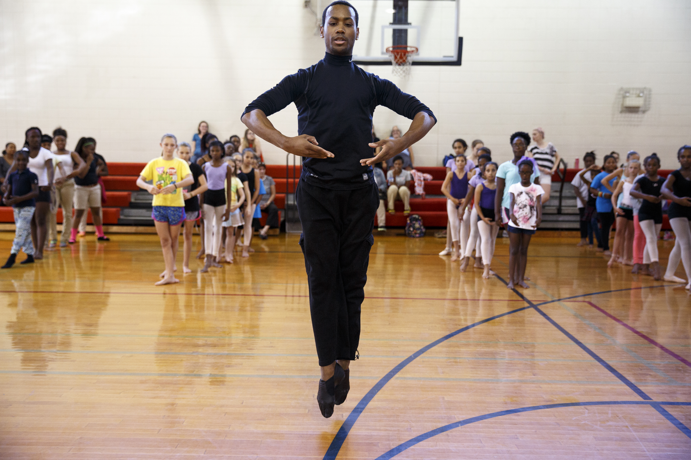 Dancer Fred Davis demonstrates for students during a master class in dance at the Brainerd Recreation Center on Tuesday, Sept. 15, 2015, in Chattanooga, Tenn. Davis, a Chattanooga native and Center for Creative Arts graduate, is now a professional dancer working in New York City.