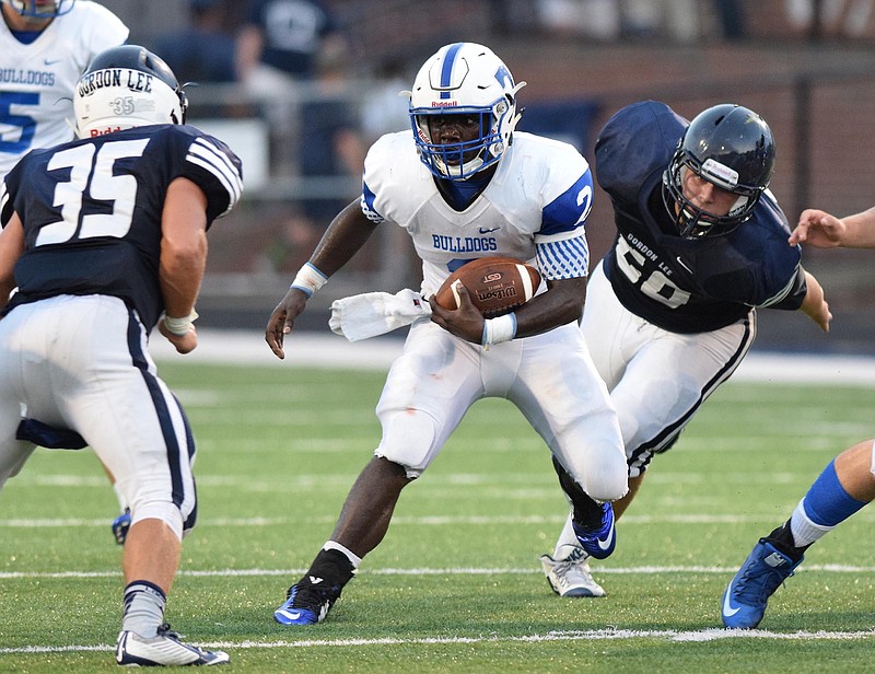 Trion's Malik Martin (2) looks for running room in the Gordon Lee defense. The Trion Bulldogs visited the Gordon Lee Trojans in Georgia High School football action at Billy Neil Ellis Stadium in Chickamauga, Ga. Friday Night, August 21, 2015.  

