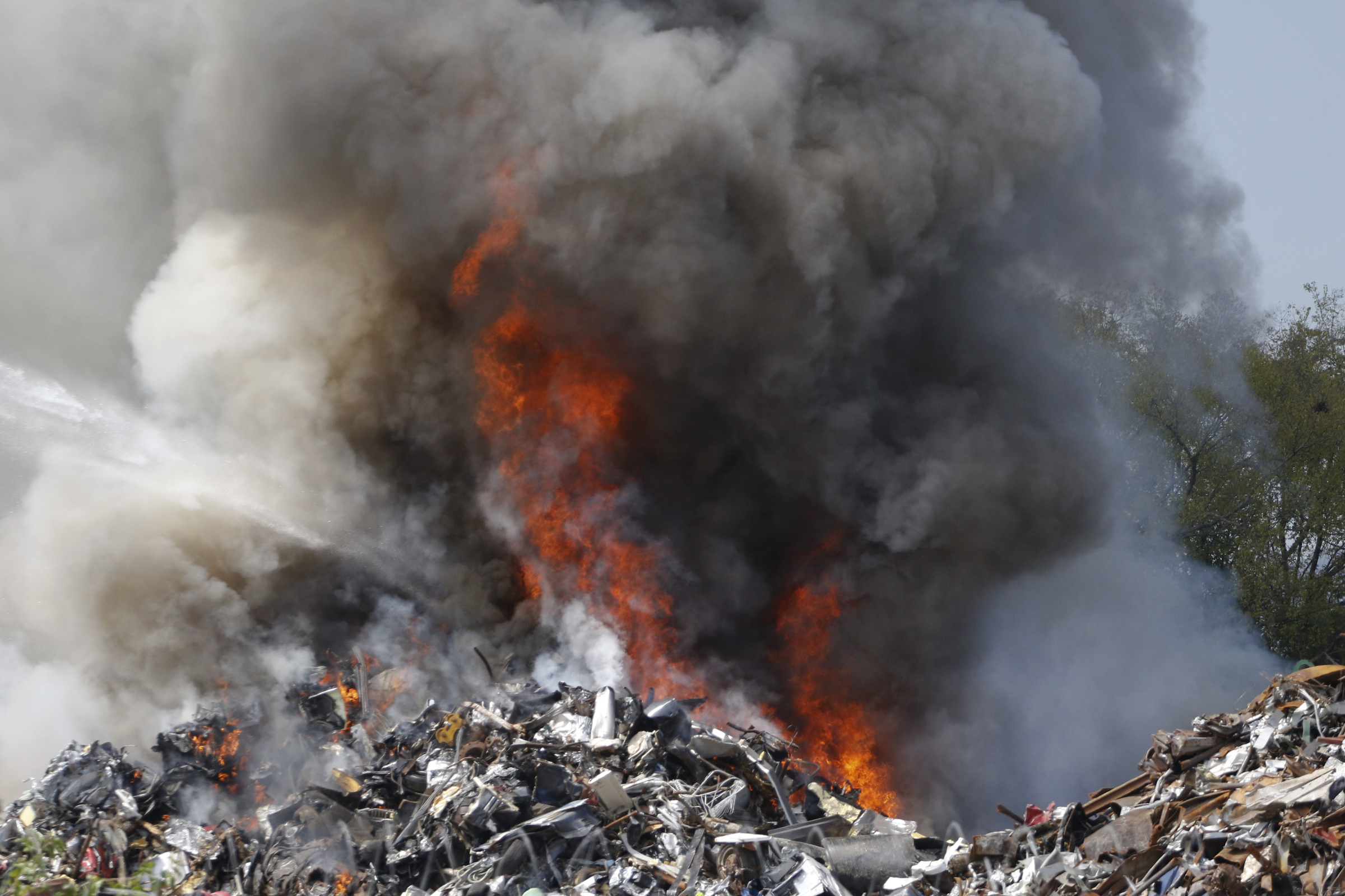 Chattanooga Fire Department firefighters respond to a blaze in a scrapyard off of Central Ave in downtown Chattanooga on September 17, 2015.