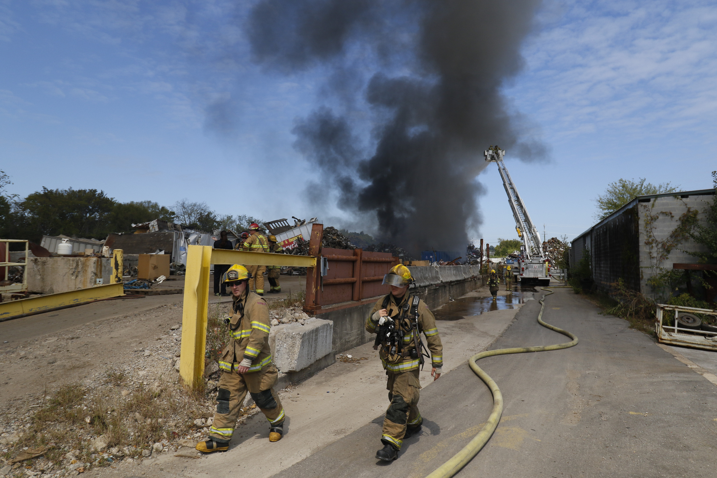 Chattanooga Fire Department firefighters respond to a blaze in a scrapyard off of Central Ave in downtown Chattanooga on September 17, 2015.
