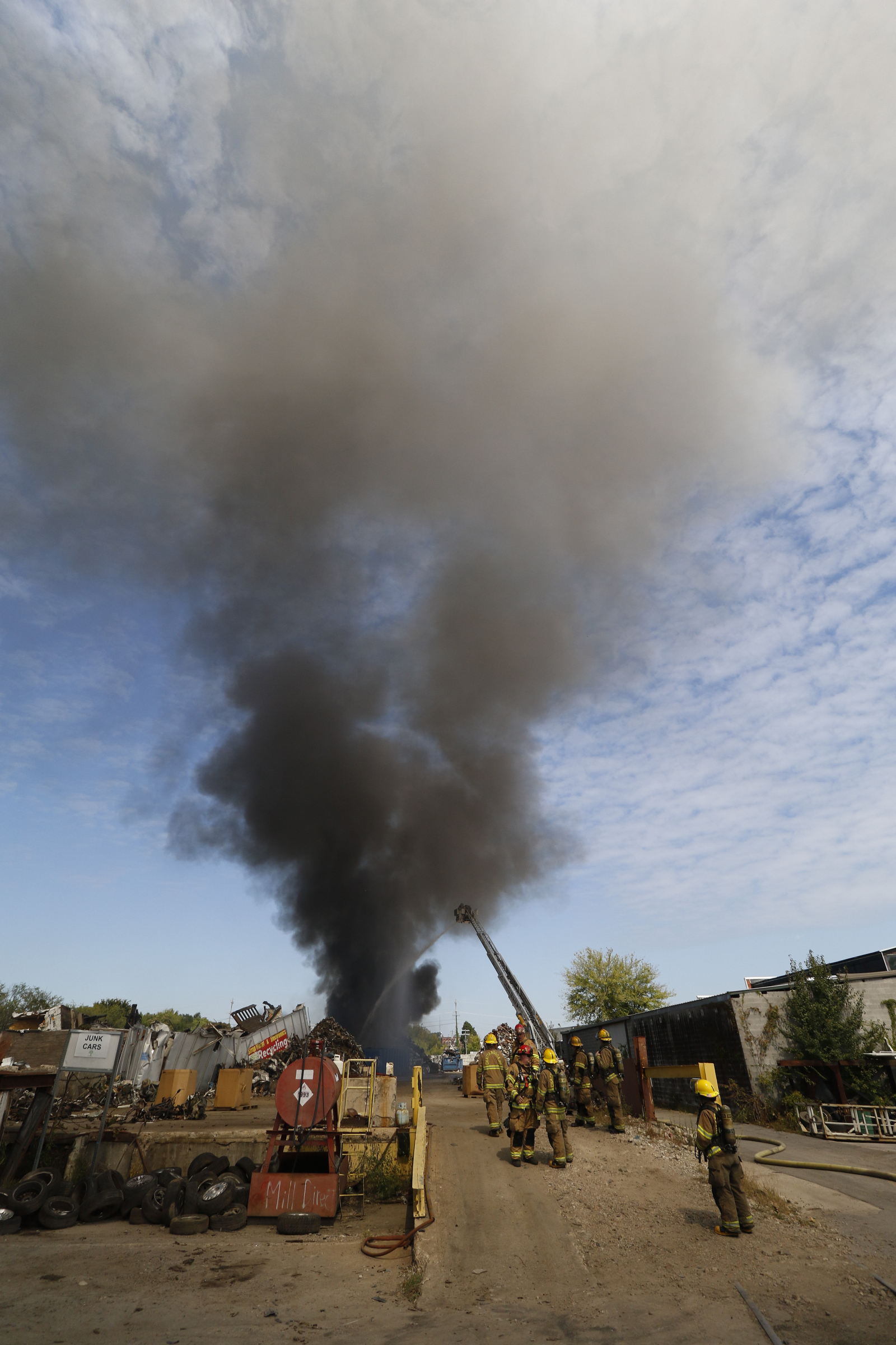 Chattanooga Fire Department firefighters respond to a blaze in a scrapyard off of Central Ave in downtown Chattanooga on September 17, 2015.