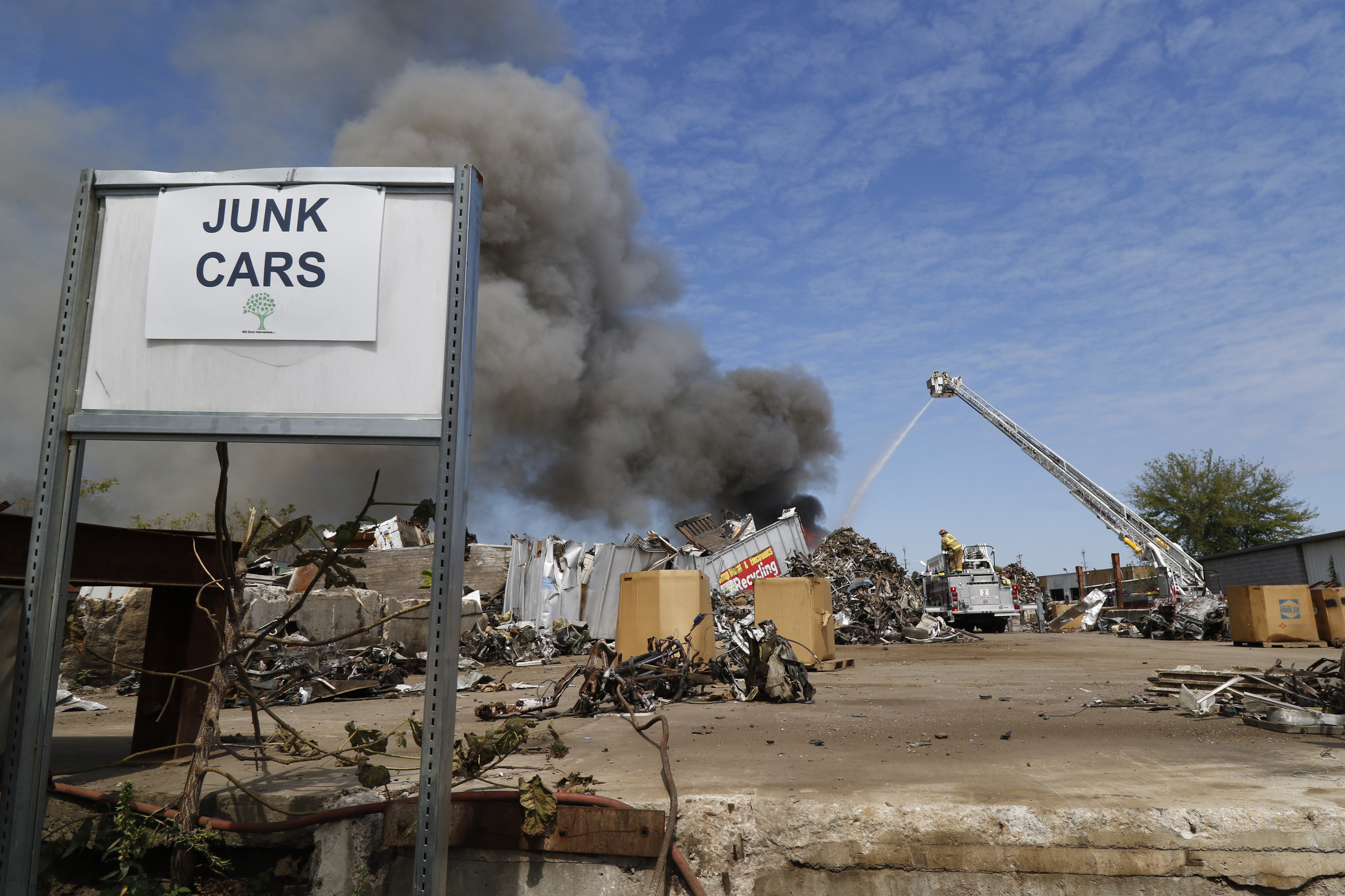 Chattanooga Fire Department firefighters respond to a blaze in a scrapyard off of Central Ave in downtown Chattanooga on September 17, 2015.