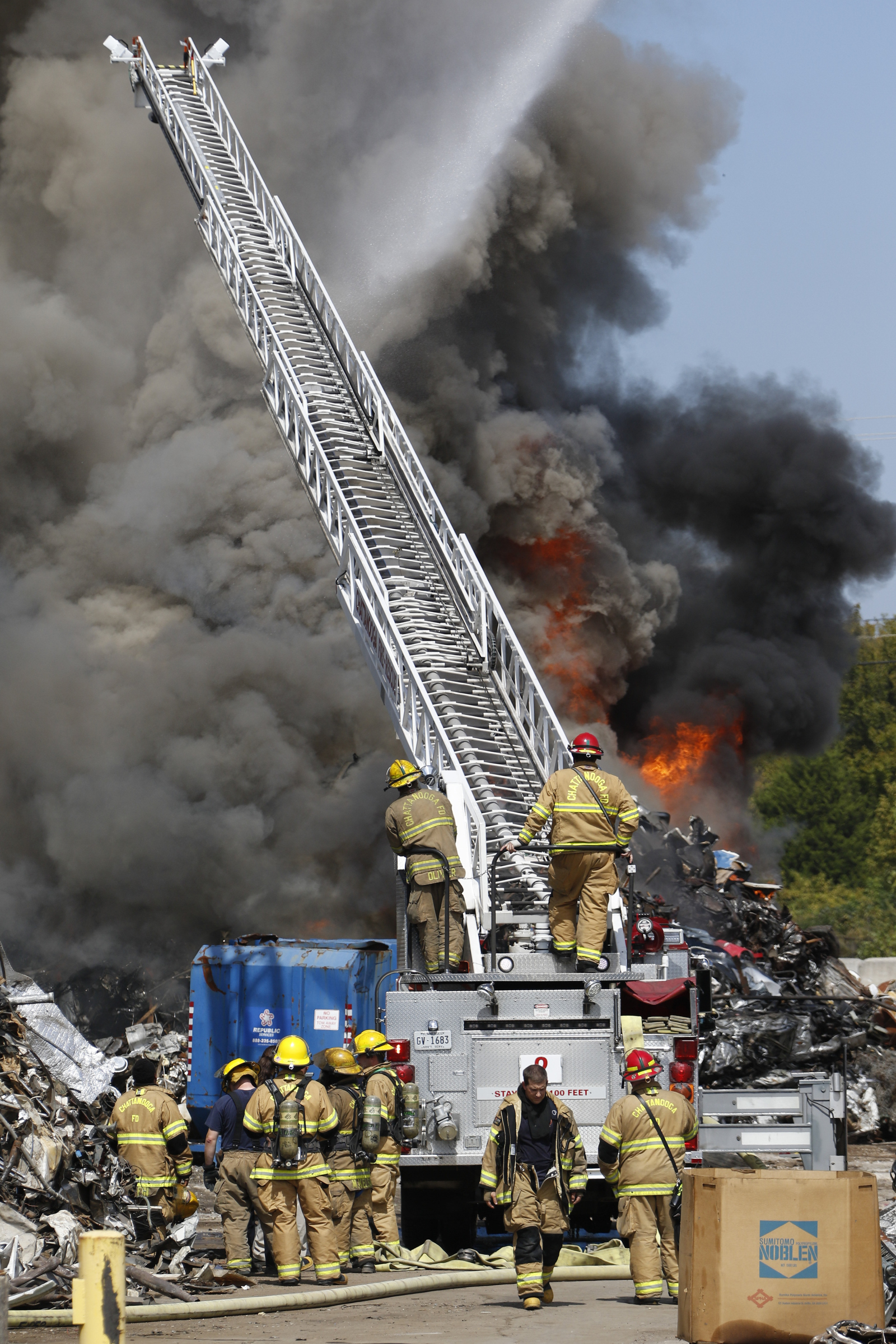 Chattanooga Fire Department firefighters respond to a blaze in a scrapyard off of Central Ave in downtown Chattanooga on September 17, 2015.