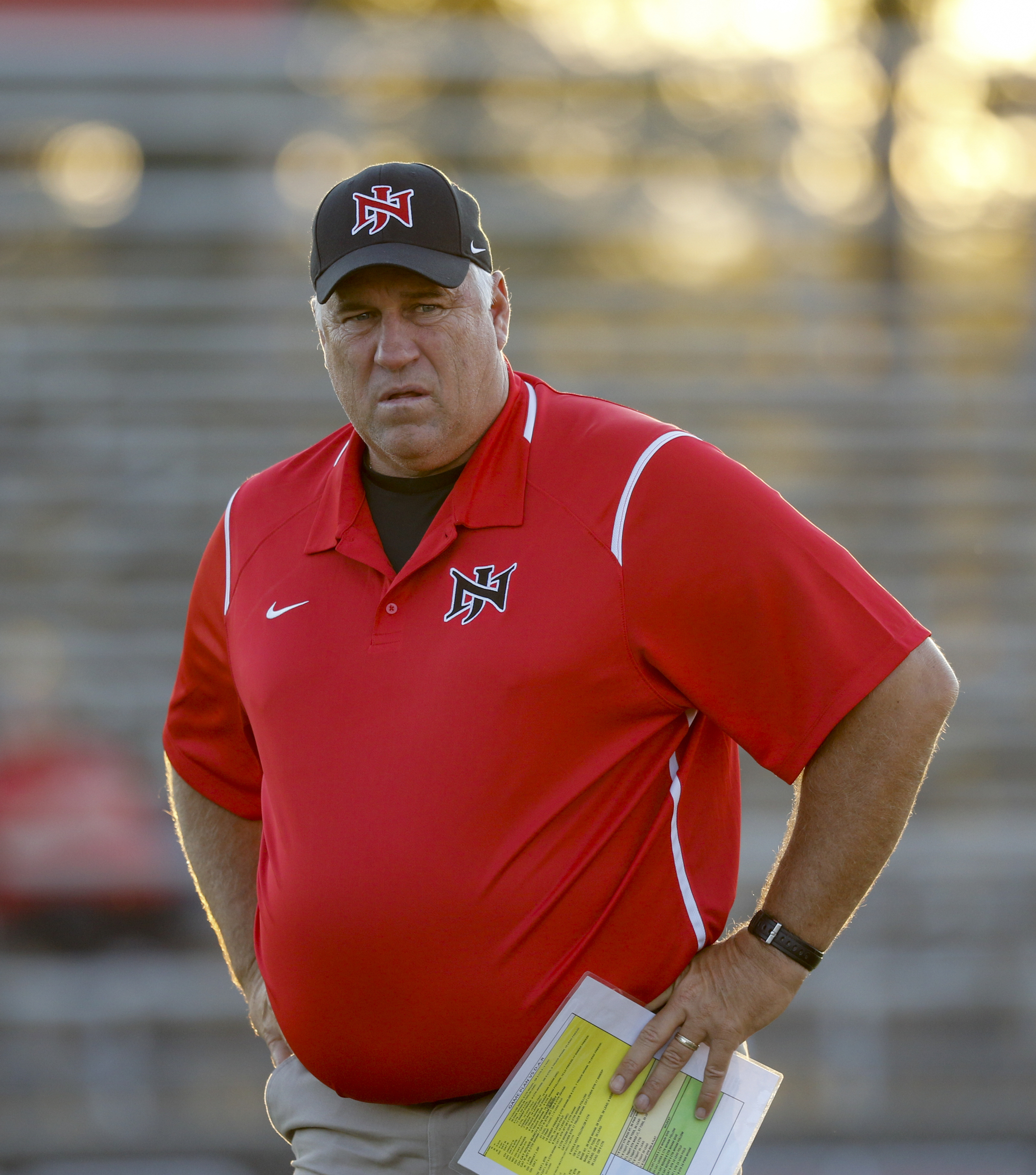 North Jackson head football coach Mark Rose watches players warm up before their prep football game against DAR at North Jackson High School on Thursday, Sept. 17, 2015, in Stevenson, Ala.