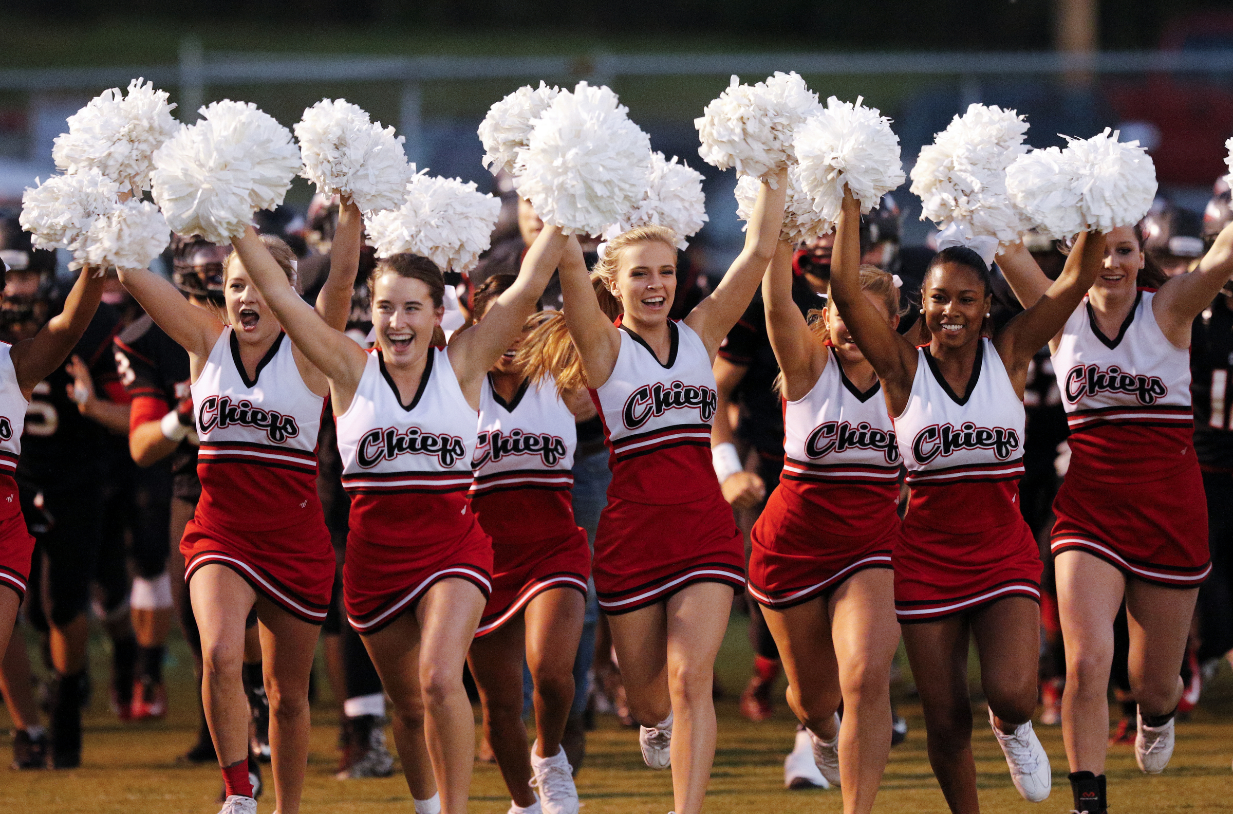 North Jackson cheerleaders take the field ahead of the team for their prep football game against DAR at North Jackson High School on Thursday, Sept. 17, 2015, in Stevenson, Ala.