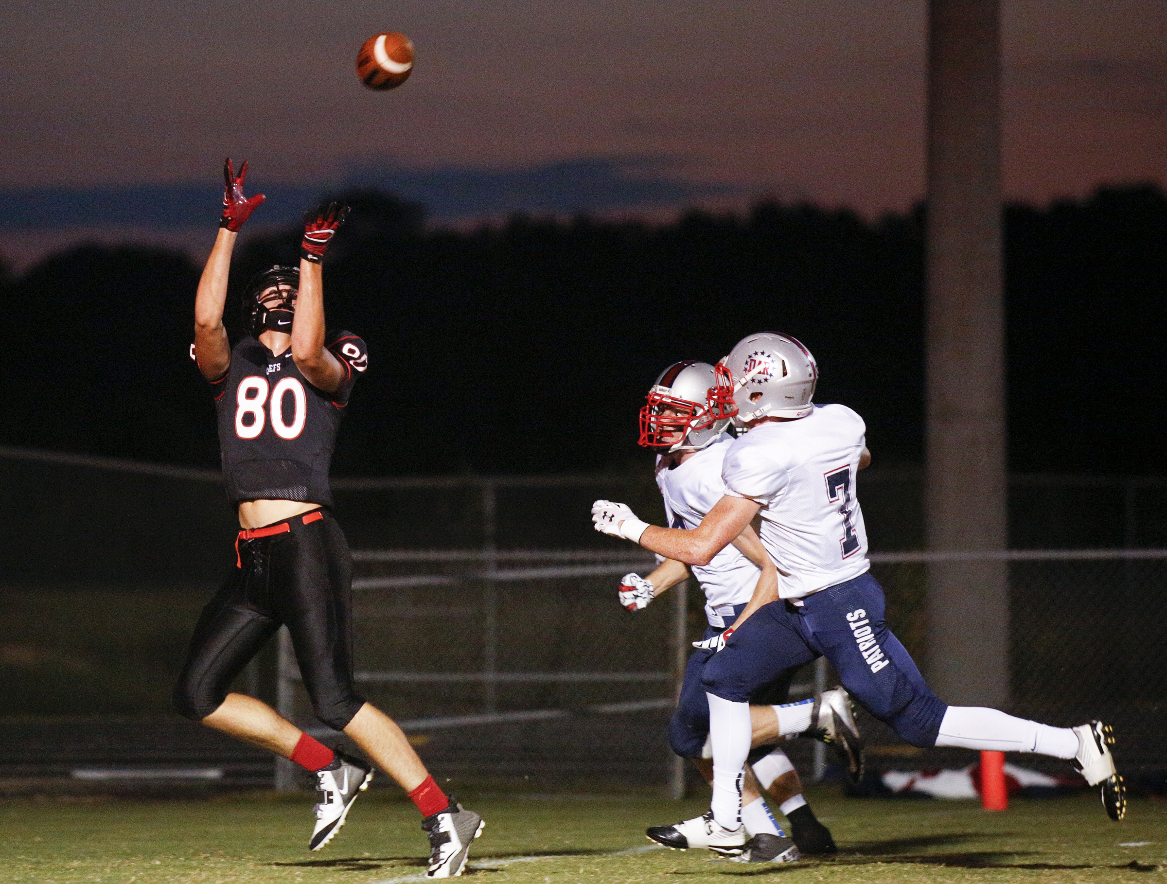 North Jackson tight end Austin Cummings catches a pass in the end zone for a touchdown ahead of DAR defenders Carson Matthews, right, and Tyler Troup during their prep football game against DAR at North Jackson High School on Thursday, Sept. 17, 2015, in Stevenson, Ala.