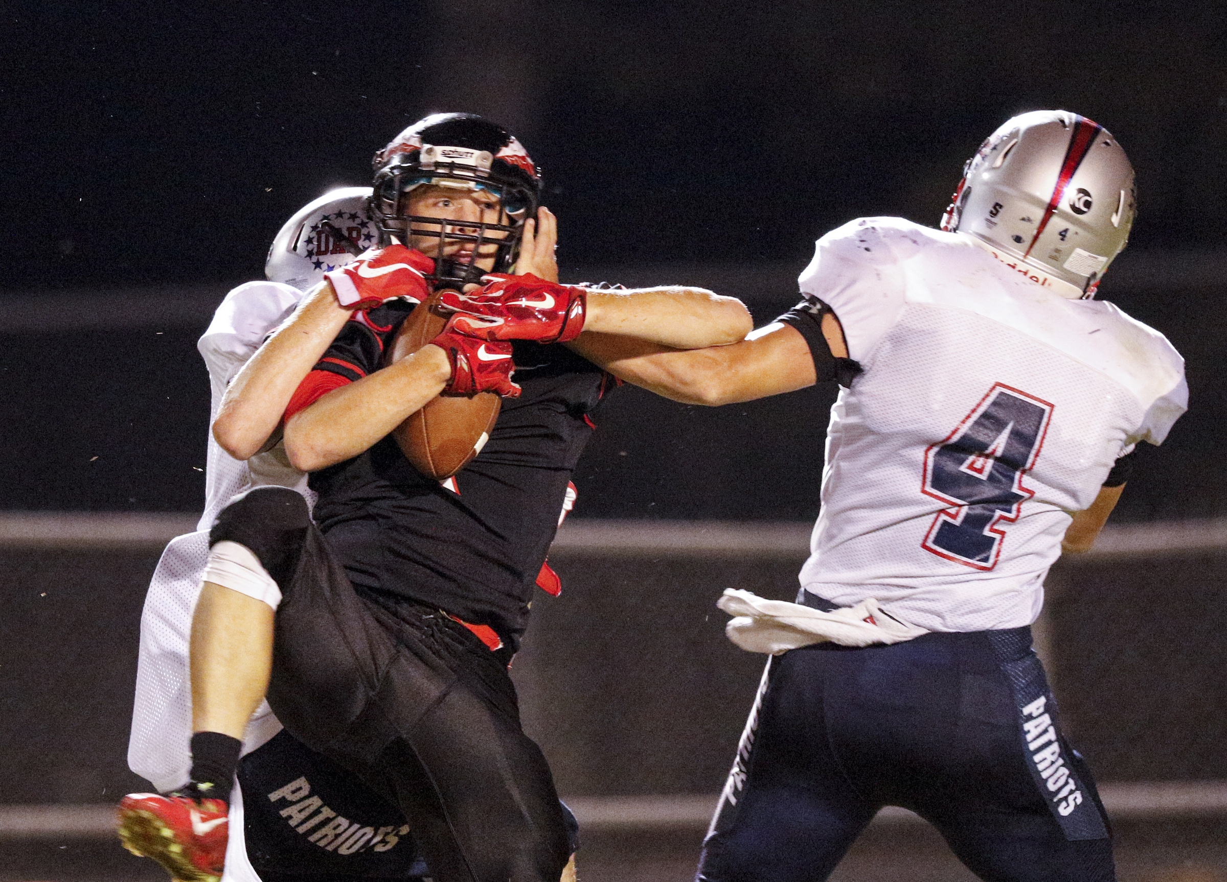 North Jackson wide receiver Brody Grider, center, catches a deep pass against coverage by DAR defenders Troy Steele, right, and Alex Fox during their prep football game against DAR at North Jackson High School on Thursday, Sept. 17, 2015, in Stevenson, Ala.